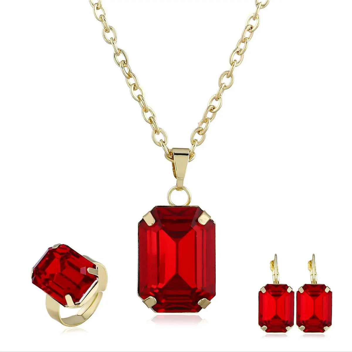 Elegant necklace earring set with red rectangular gemstones and gold chain, displayed with matching ring.