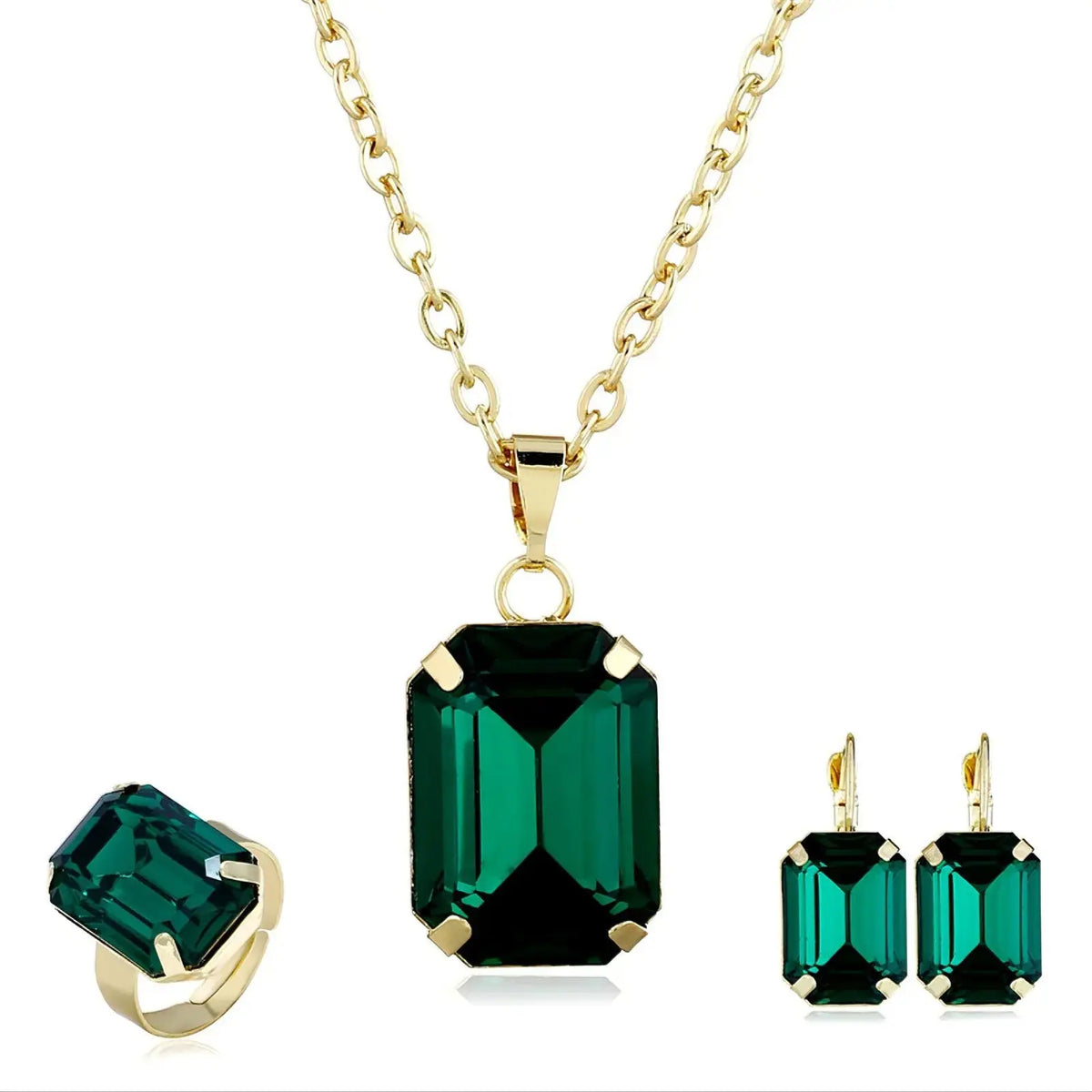 Elegant necklace earring set featuring green rectangular gemstones and gold chain, displayed with matching ring.