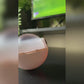 pink washable lint roller in use