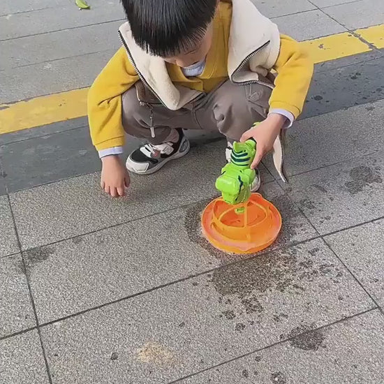 Green dinosaur-shaped bubble gun with bubbles in a grassy outdoor setting