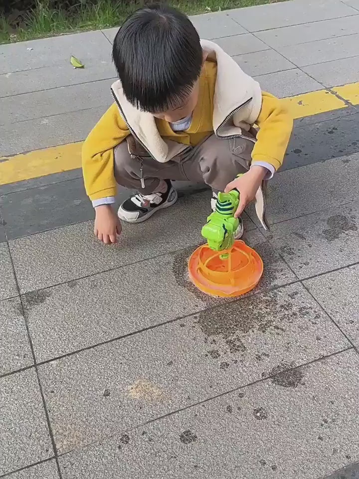 Green dinosaur-shaped bubble gun with bubbles in a grassy outdoor setting