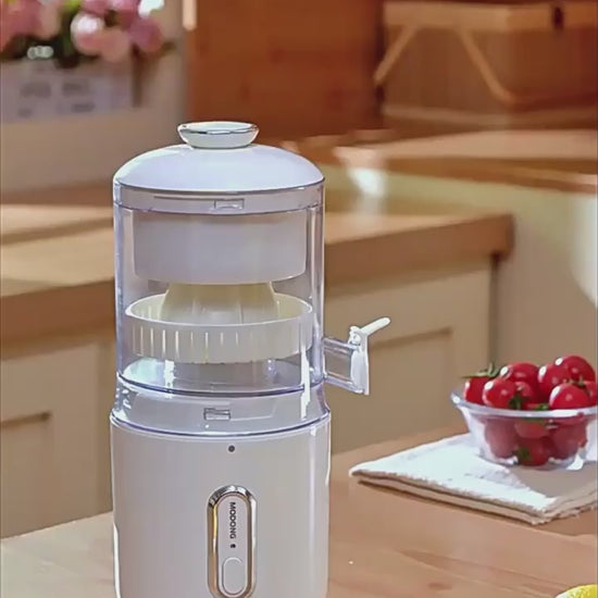 Person using a manual juicer to extract orange juice in a kitchen setting FRESH WHITE
