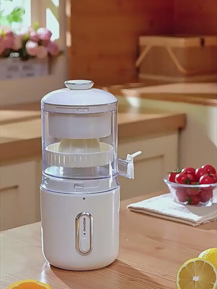 Person using a manual juicer to extract orange juice in a kitchen setting FRESH WHITE