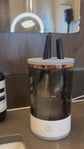 Brush cleaner with brushes inside on a marble surface HOW TO USE IT EFFECTIVELY