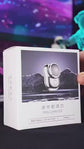 Green electric shaver on a light gray background UNBOXING