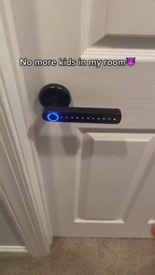 Black Smart door lock system with digital keypad and smartphone app on a white background in use.