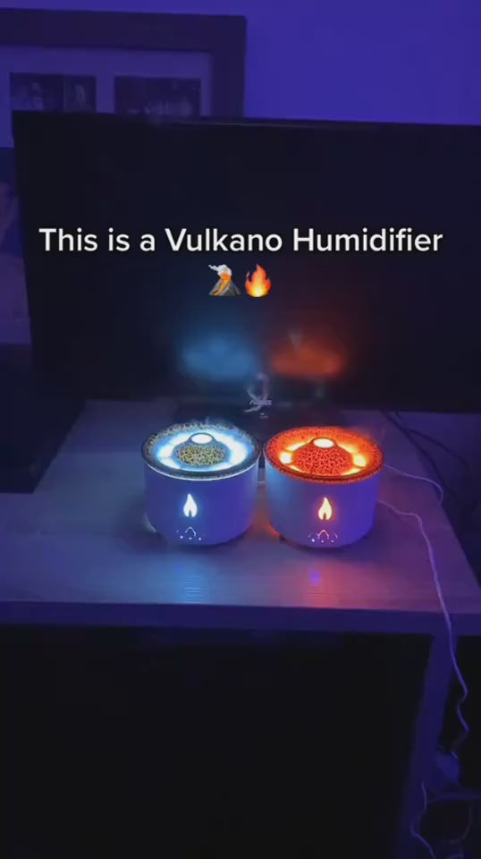 Two flameless candle lights with fire and water effects on a wooden surface.  YELLOW AND BLUE