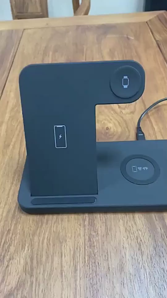 Multi-device charging station with smartphone, smartwatch, and earbuds on a white background