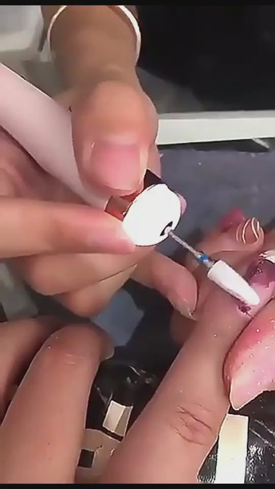 Pink nail drill with attachments and cable on a soft surface PINK UNBOXING