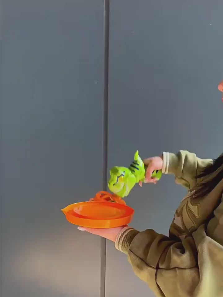 Green dinosaur-shaped bubble gun with bubbles in a grassy outdoor setting