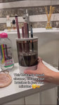 Makeup brush cleaner with brushes inside on a light surface HOW TO USE IT