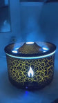 1.White flameless candle with orange glow on a wooden surface