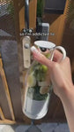 Pink bottle labeled &